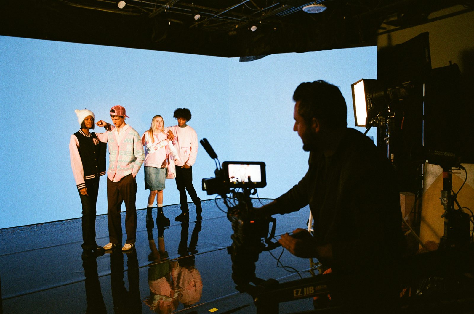 Directing on-camera talent on a lit studio cyclorama for a commercial campaign